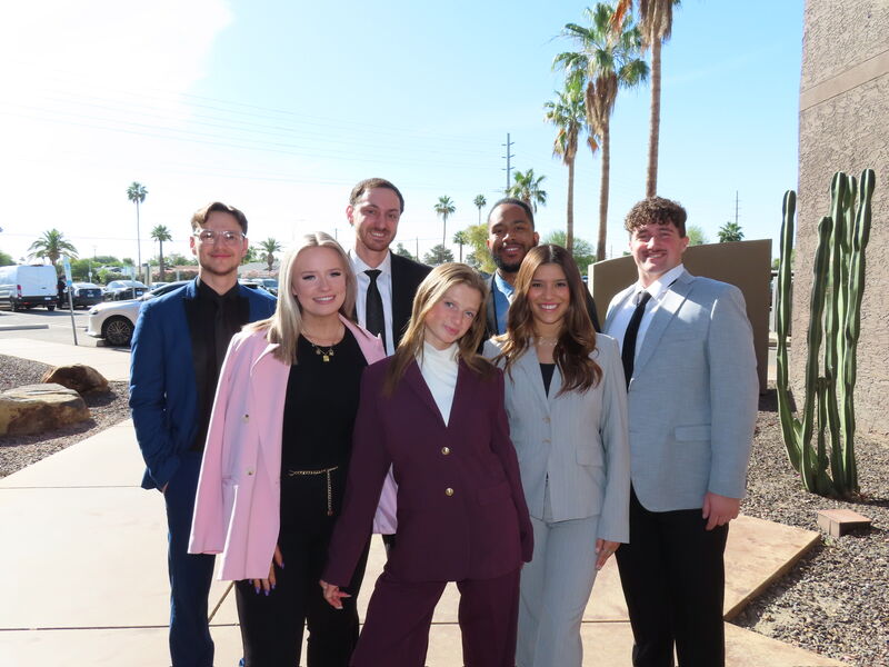 Skyline Marketing Agency team gathered outdoors on a sunny day