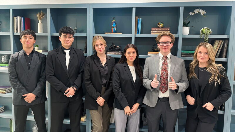 Six Skyline Marketing Agency team members in business attire
