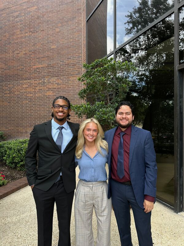 Three Skyline Marketing Agency team members in business attire