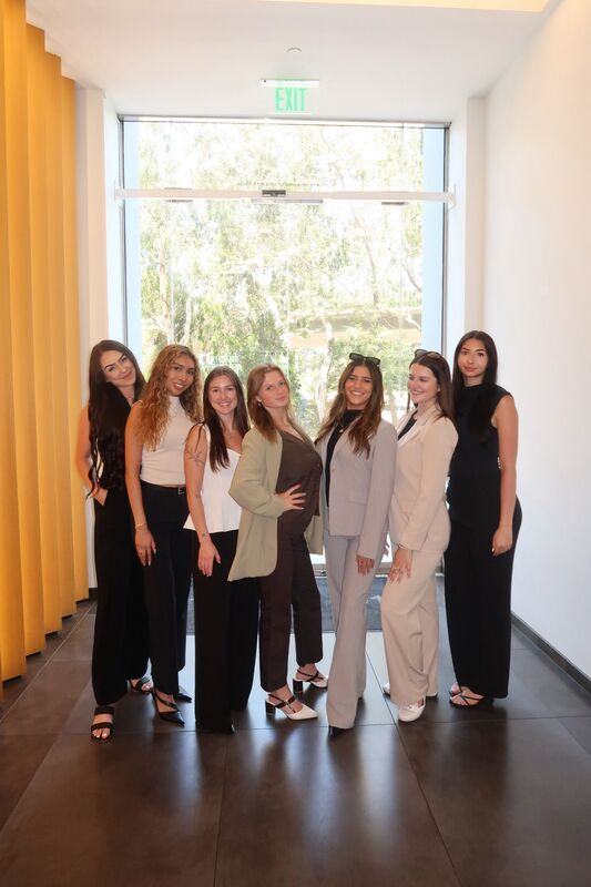Skyline Marketing Agency team members together in an office hallway